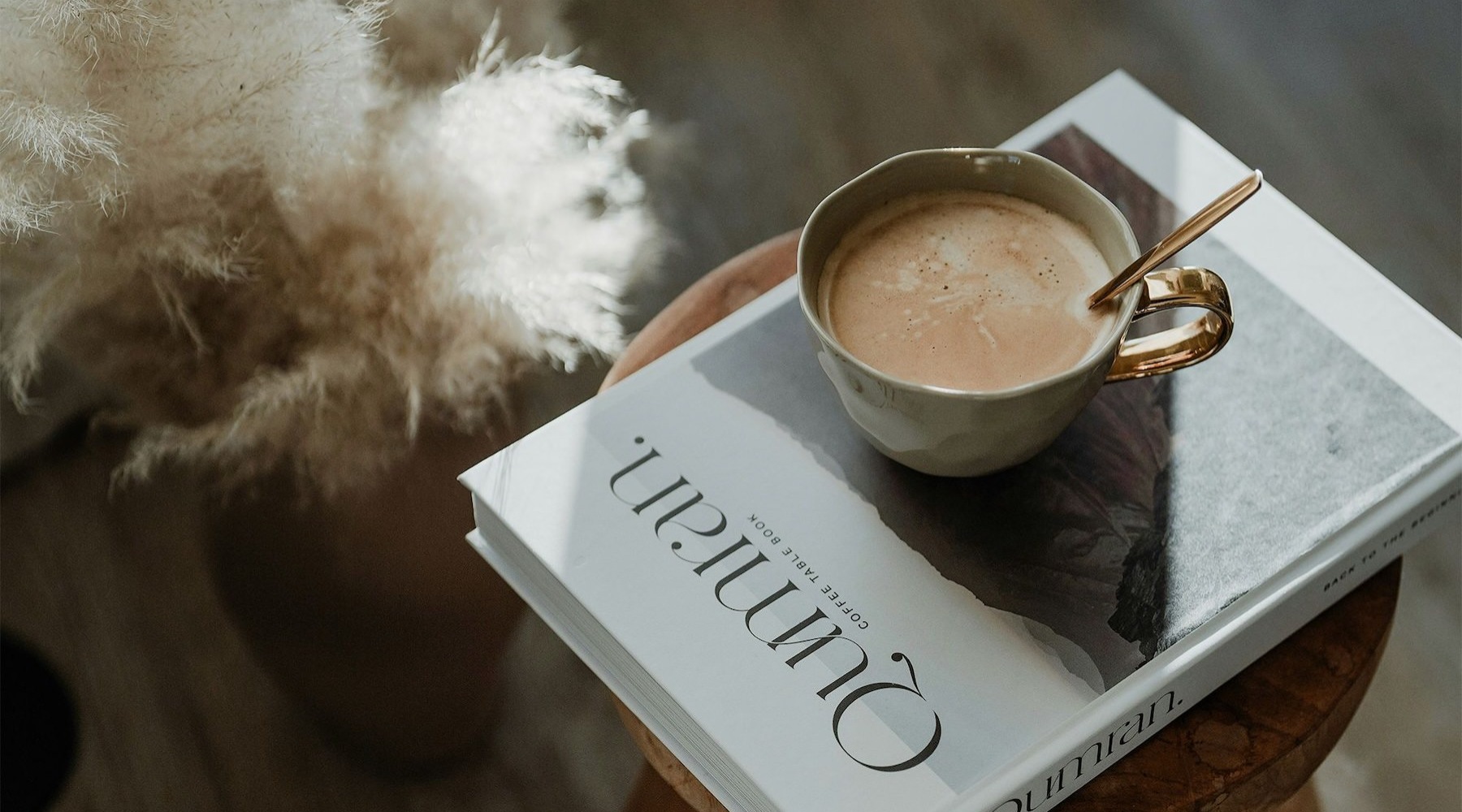 a cup of coffee on a book