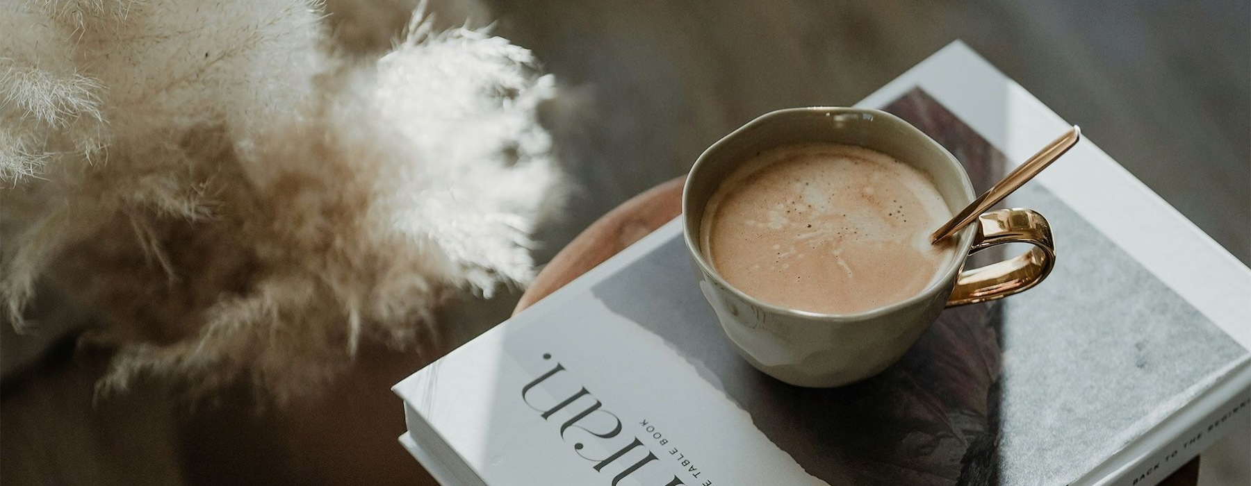 a cup of coffee on a book
